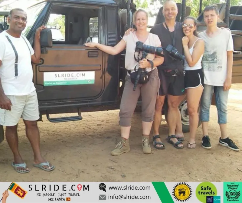 Happy guests with their safari guide after a Yala jeep tour